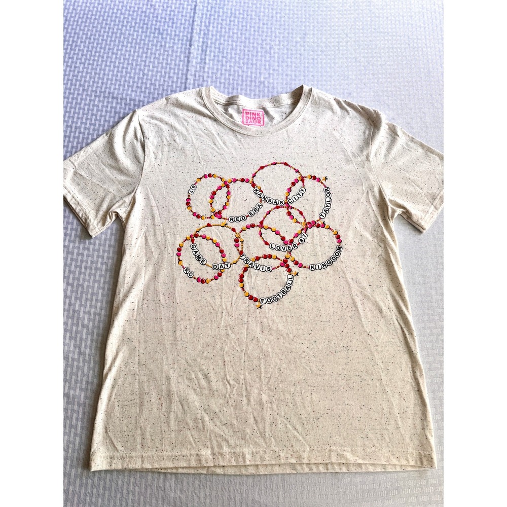Pink Dinosaur Taylor Swift Travis Kelce Friendship‎ Bracelet Speckled Tee Large